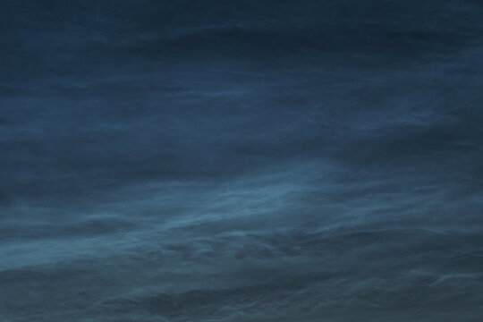 Noctilucent clouds in the night sky. Beautiful natural background. . High quality photo