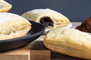 Chocolate strudels covered with sugar close up.