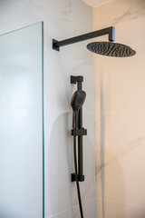 black shower head in a bathroom