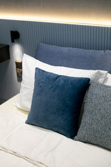 blue pillow on a bed