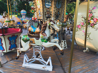 Retro children carousel in the park, empty carousel 