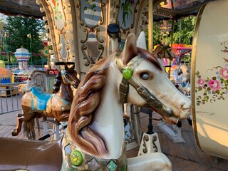 Fototapeta na wymiar Retro children carousel in the park, empty carousel 