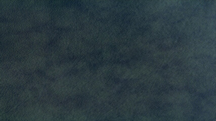 Texture of dark green leather for decorative background.