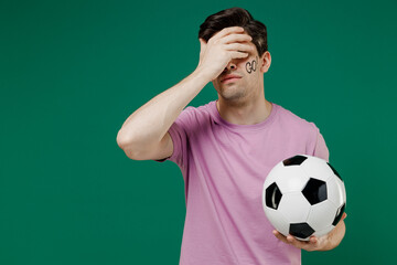 Young fun european man fan supporter wear basic pink t-shirt cheer up support football sport team...
