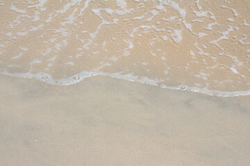 Fototapeta na wymiar wave sea sand beach travel concept 