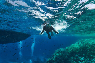 person snorkeling in the sea