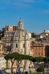 Obraz premium The Church of the Most Holy Name of Mary at the Trajan Forum (Santissimo Nome di Maria al Foro Traiano) and Trajan's Column in Rome, Italy