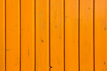 Vintage yellow wood background texture with knots and nail holes. Old painted wood wall