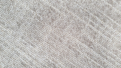 close up of monochrome of white and beige carpet texture background for interior flooring material....