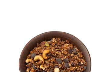 Chocolate granola cereal with nuts in a bowl background.