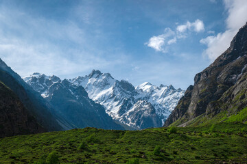 Fototapeta na wymiar A chain of mountain peaks in the Bezengi Gorge of the Kabardino-Balkarian Natural Reserve