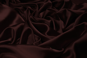 Rich and luxury red silk fabric texture background.