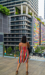 woman walking on the street building colors urban Miami Florida Brickell people lifestyle fashion 