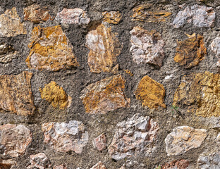 rough stone wall closeup, seamless natural background