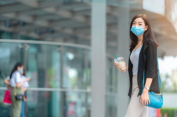 Beautiful asian woman walking for go to work,Young Successful Business woman in a big city