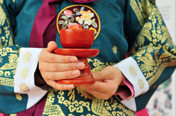 Drinking at the traditional Korean coming-of-age ceremony