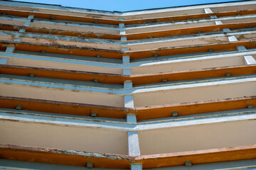 The facade of an abandoned hotel. Architectural elements. Hotel floors.