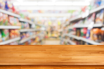 wood table on blurred bokeh light supermarket background
