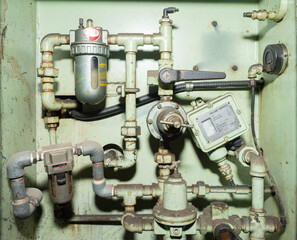 Hydraulic piping system of CNC machines installed in industrial cabinets.