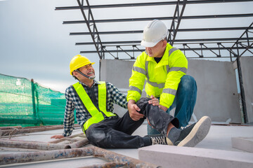 Accident at construction site. Physical injury at work of construction worker. First Aid Help a construction worker who accident at construction site. First Aid Help at accident in constructions work.