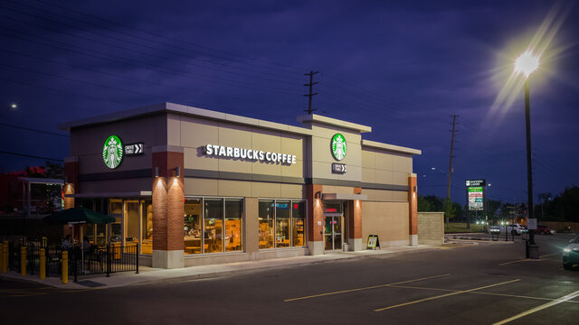 MARKHAM, CANADA - JUNE 11, 2021: Starbucks branch at Bayview Lane Plaza  the first day after the patio reopening due to the  COVID-19 restrictions illuminated at night