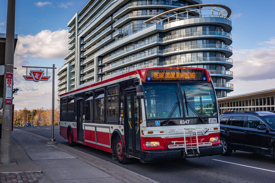 TORONTO, CANADA - APRIL 01, 2020: Toronto Transit Commission bus with a sign asking to board the rear door only due to the COVID 19 pandemic