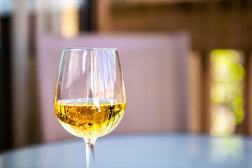 Closeup macro of alcohol hard cider with yellow color drink and carbonated bubbles as sparkling...