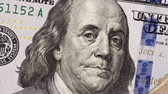 Smiling portrait of Benjamin Franklin with a glaring flash in his eye. Seamlessly loop animation, 16-bit depth.