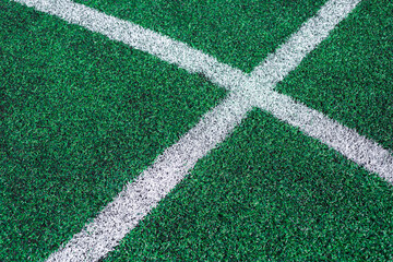 football field. green grass and white soccer field markings