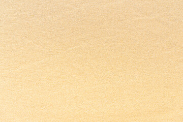 Fototapeta na wymiar Sand texture on the beach. Brown beach sand for background.