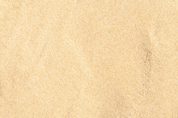 Sand texture on the beach. Brown beach sand for background.