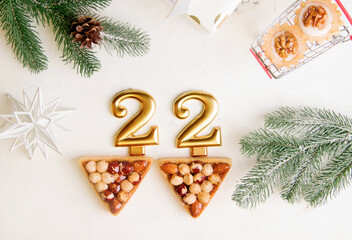 2022 new year numbers on white background next to cookies