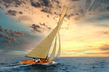 Rolgordijnen Sailboat sailing in the Mediterranean Sea at sunset © Giovanni Rinaldi