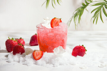 Strawberry cocktail with ice on a light background