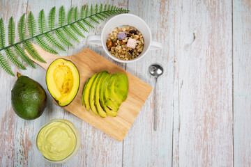 healthy eat and lifestyle with avocado slice ,smoothie and breakfast on wooden background
