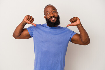 African american man with beard isolated on pink background feels proud and self confident, example to follow.