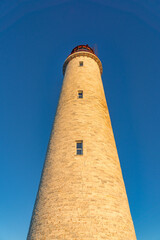 Close up view of the tower and the beacon of the Cap des Rosiers lighthouse, the highest in Canada, located near Forillon National Park n Quebec