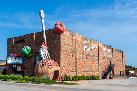 Branson, MO - June 9, 2021: Pasghetti's Restaurant and Attraction features a giant meatball with a fork stuck in it at the front of the building.