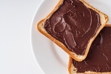 toasts with chocolate butter on a white acrylic background