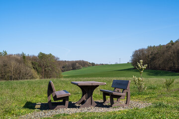 Picnic table with two benches in the park