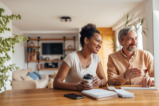 Adult couple, browsing apartments online.
