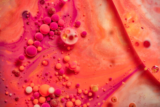 Bright and colorful abstract background from acrylic paints and oil mix, Macro bubble photography for wall art. Acrylic paint and oil mix forming Bubble colorful.