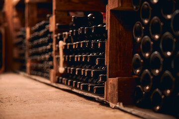 Wine bottles with corks stored in wine cellar