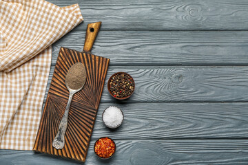Different spices on dark wooden background