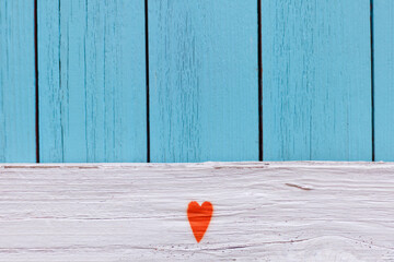 orange heart on a Distressed Vintage Boy Blue Grunge Wood Grain Texture Background. Shabby wood...