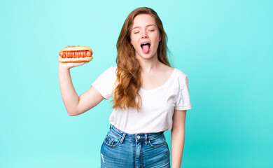 red head pretty woman with cheerful and rebellious attitude, joking and sticking tongue out and...