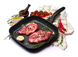 Fresh raw beef or pork steaks on frying pan