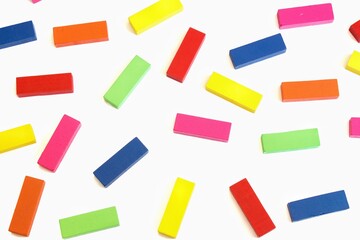 Top view of colored wooden game blocks pattern background.