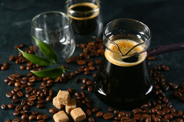 Composition with aromatic turkish coffee, sugar and beans on dark background