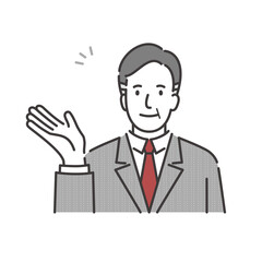 笑顔で案内をするスーツ姿のミドルシニアのビジネスマン